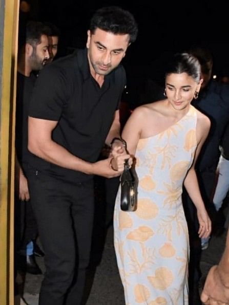 Celebrity couple Ranbir Kapoor and Alia Bhatt walking hand-in-hand for a dinner.