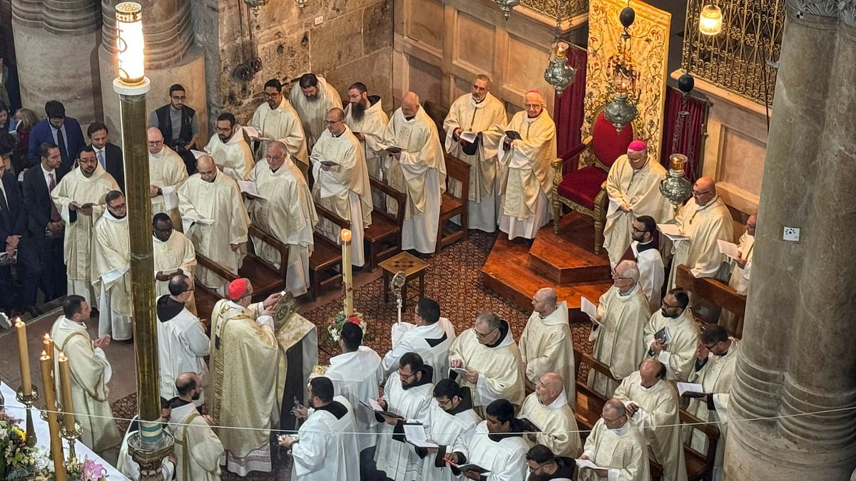 Latin Patriarch of Jerusalem, Archbishop Pierbattista Pizzaballa, leads Easter Sunday Mass in the Church of the Holy Sepulchre in Jerusalem's Old City.
