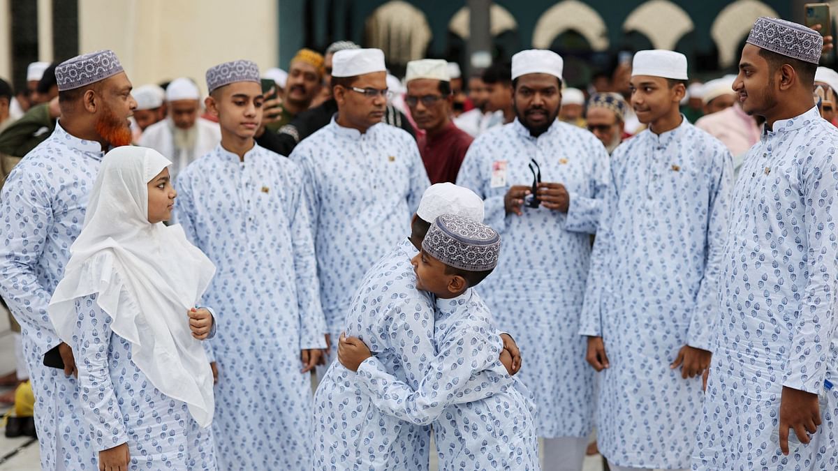 Children hug after performing the Eid al-Fitr prayer at the Baitul Mukarram National Mosque, in Dhaka.