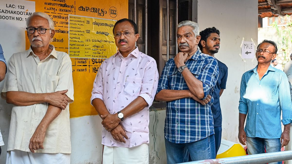 Union Minister and BJP candidate V Muraleedharan  standing in a queue to cast his vote in the second phase of Lok Sabha elections, in Thiruvananthapuram.