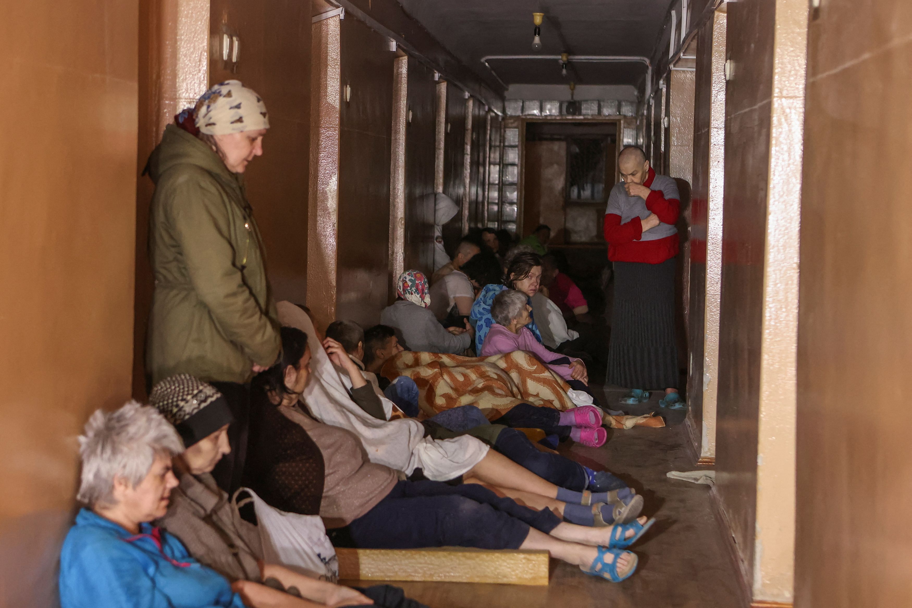 Patients take a shelter in a corridor of a hospital during a Russian missile strike, amid Russia's attack on Ukraine, in Kharkiv, Ukraine April 27, 2024. 
