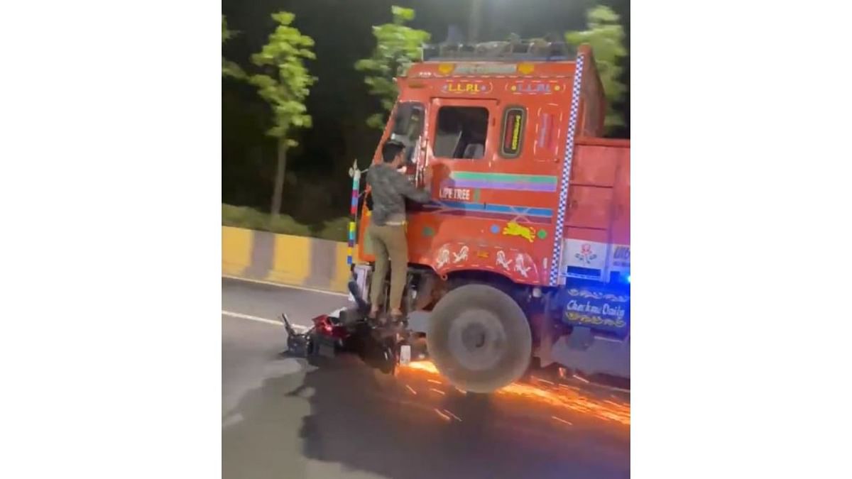 Watch: Man clings to lorry footboard as bike gets dragged under front wheels in Hyderabad
