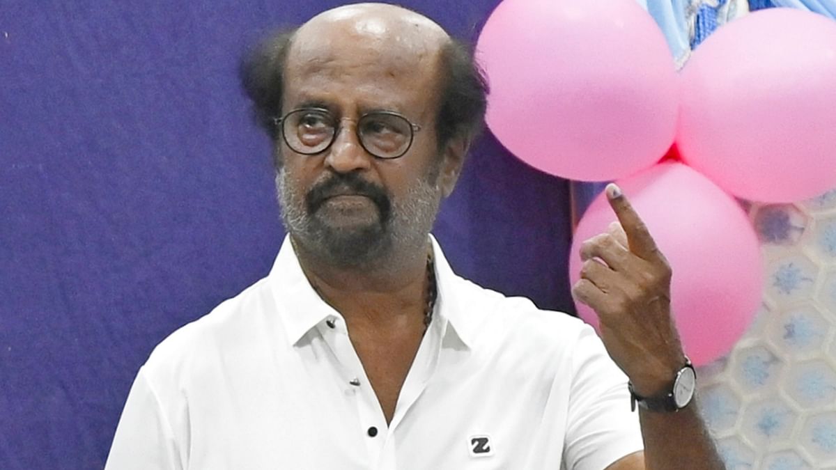 Superstar Rajinikanth shows his finger marked with indelible ink after casting his vote for the first phase of Lok Sabha elections, at a polling station in Chennai.