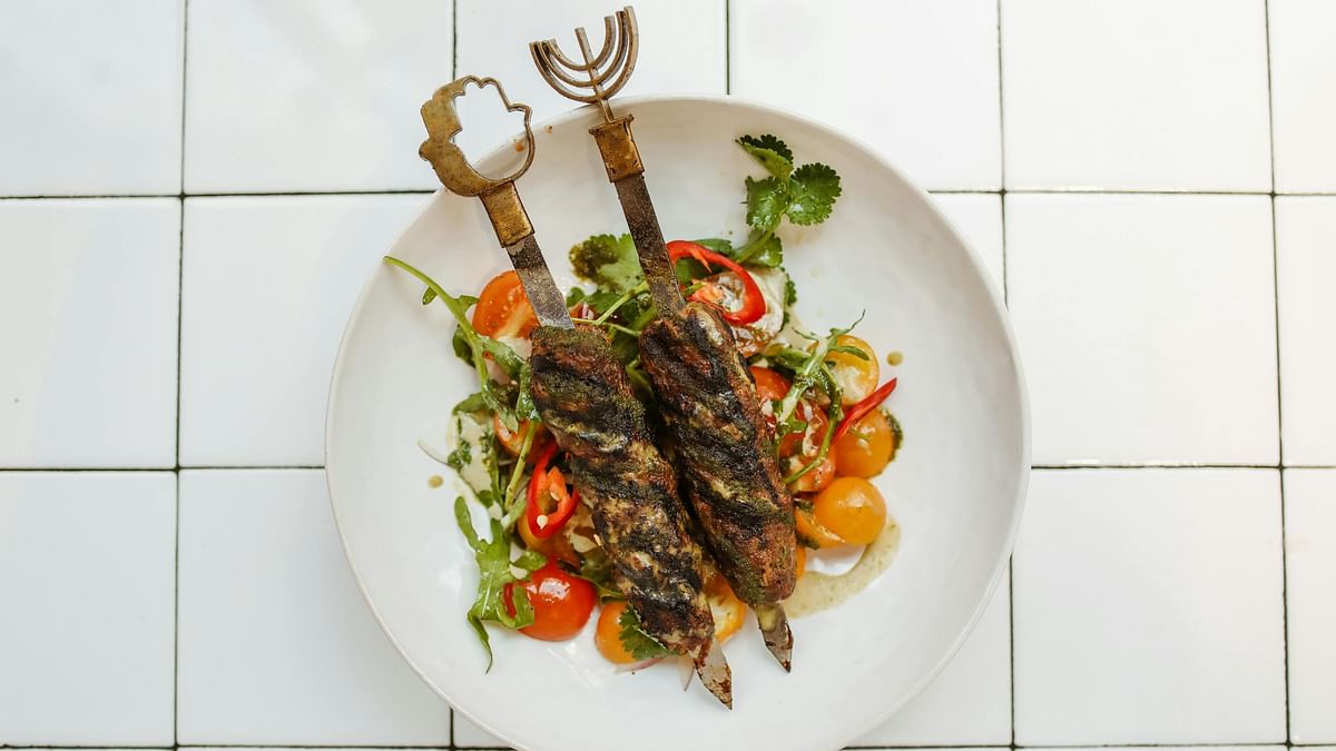 Kebabs is made with grilled pieces of meat marinated in a blend of spices and herbs. They're flavourful and tender, perfect for serving as appetisers or part of the main course.