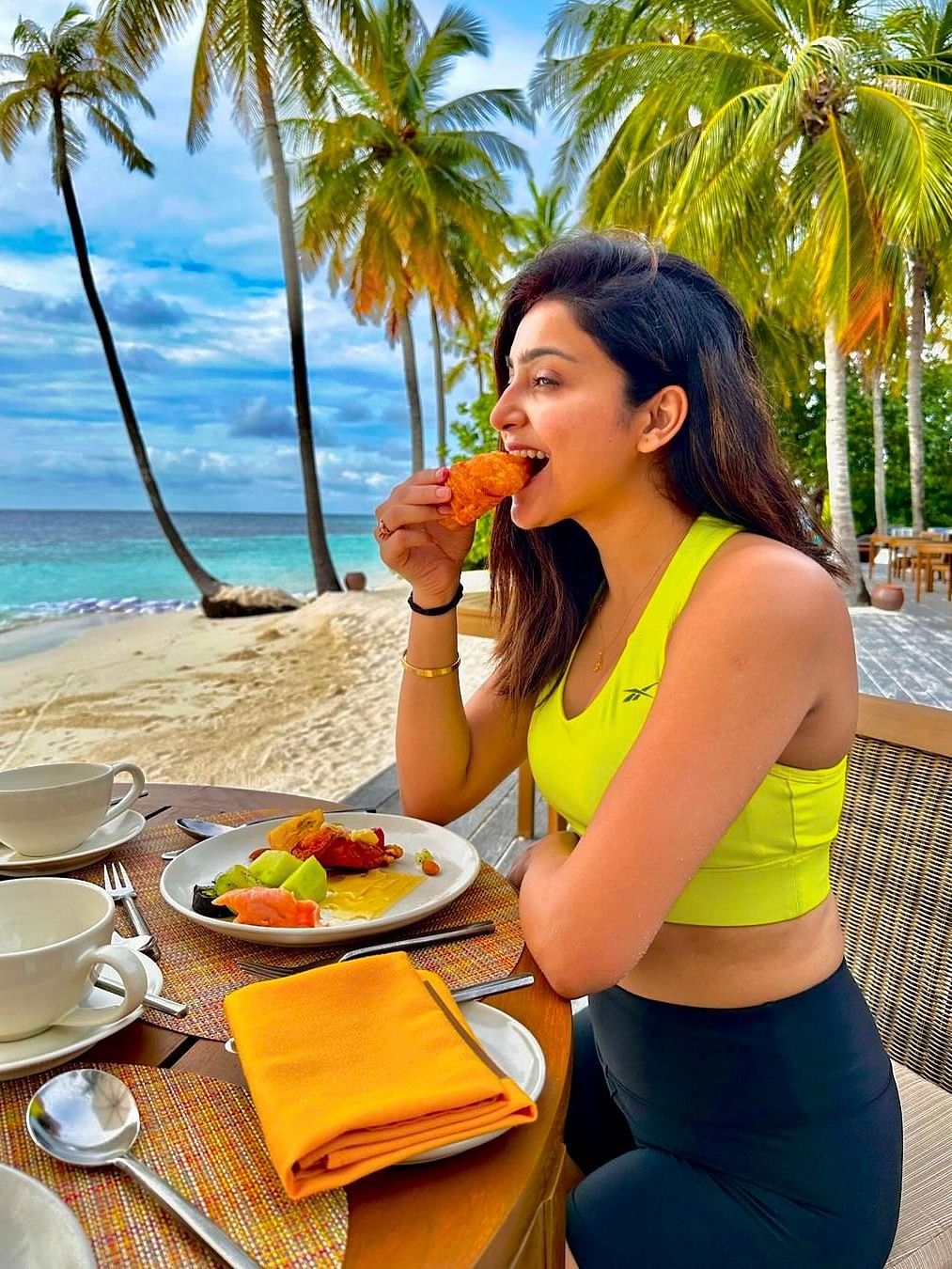 In the photograph, Avantika is seen basking in the golden sunlight while enjoying a meal.
