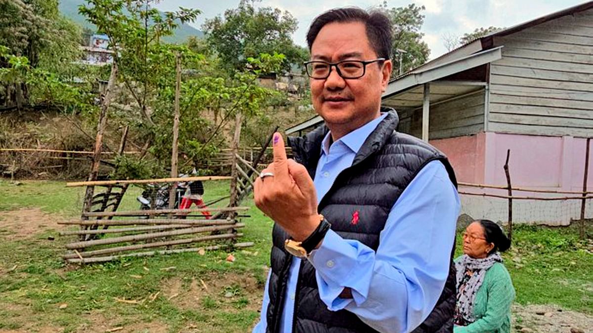 Union Minister Kiren Rijiju shows his finger marked with indelible ink after casting his vote for the first phase of Lok Sabha elections, in Nafra village, Arunachal Pradesh.