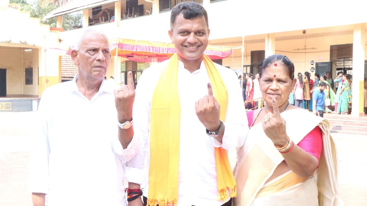 Dakshina Kannada BJP candidate Capt Brijesh Chowta and his parents, exercised their franchise at Government Girls PU College in Car Street, Mangaluru.