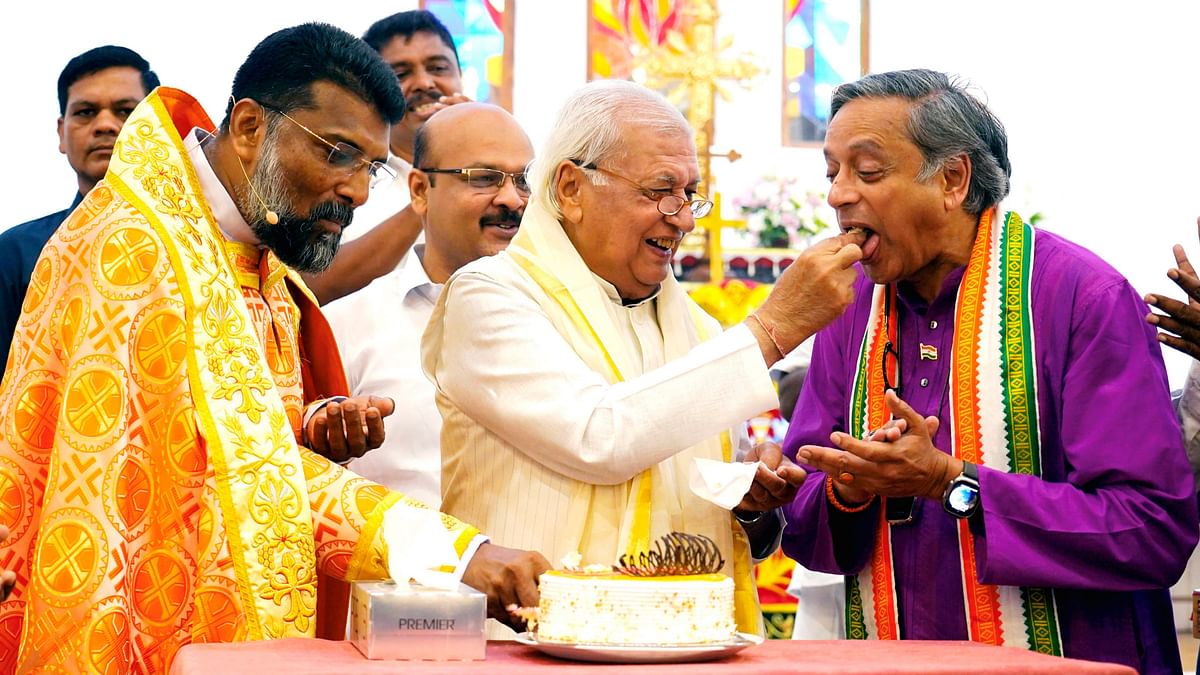 Kerala Governor Arif Mohammad Khan offers sweets to Congress leader Shashi Tharoor at the St Thomas Mar Thoma Syrian Church Pattoor on the occasion of Easter, in Thiruvananthapuram.