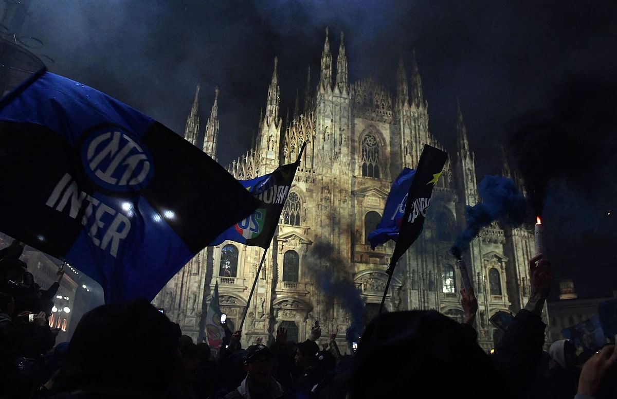 Inter flags are seen at the Piazza del Duomo in Milan amid celebrations by fans.