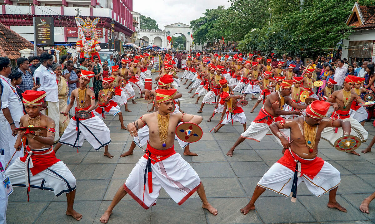 Artists perform 'Velakali' as part of the Painkuni festival of the Sree Padmanabhaswamy temple, in Thiruvananthapuram, Friday, April 19, 2024.