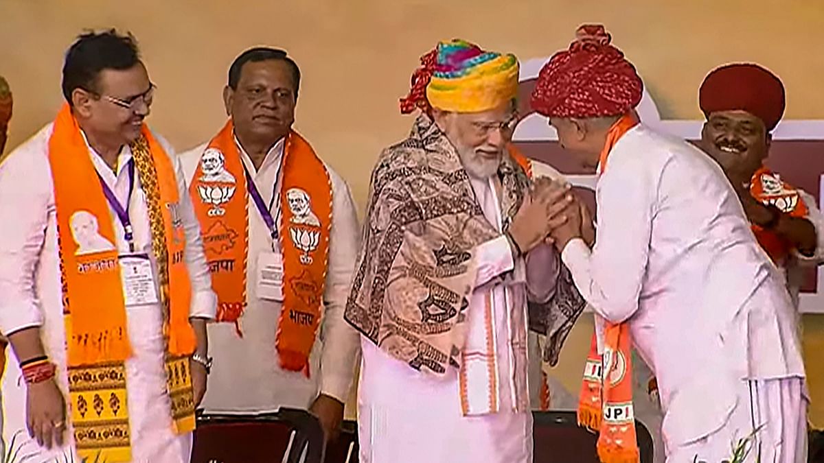 PM Modi gets a warm welcome as Rajasthan CM Bhajanlal Sharma looks on during a public meeting ahead of Lok Sabha elections, in Jalore, Rajasthan.