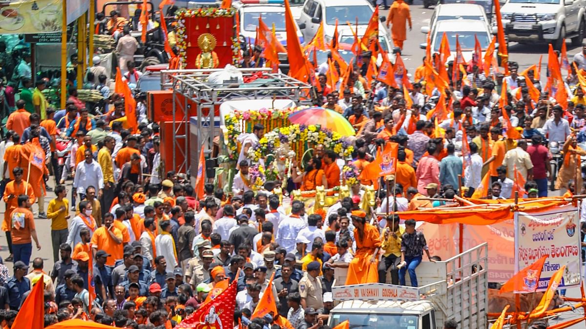 Devotees take part in a religious procession on the occasion of 'Hanuman Jayanti', in Hyderabad.