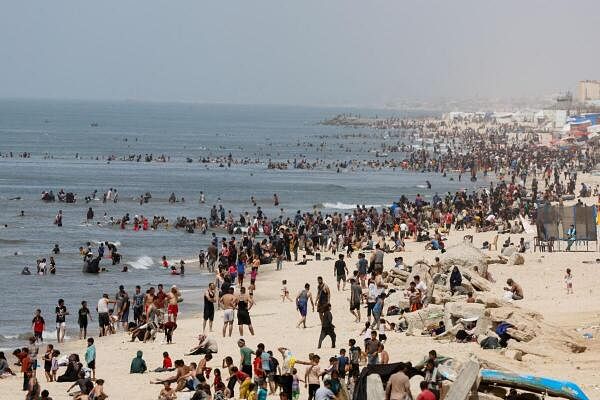 Palestinians enjoy the beach on a hot day, amid the ongoing conflict between Israel and Hamas, in Rafah, in the southern Gaza Strip, April 24, 2024.