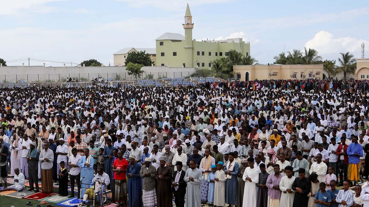Muslims attend the Eid al-Fitr prayers, marking the end of the holy fasting month of Ramadan, at the Hodan district football stadium in Mogadishu, Somalia.