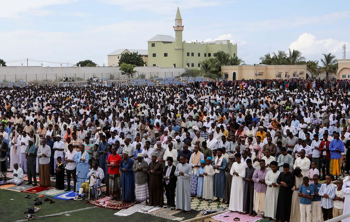 Muslim faithful attend the Eid al-Fitr prayers, marking the end of the holy fasting month of Ramadan, at the Hodan district football stadium in Mogadishu, Somalia