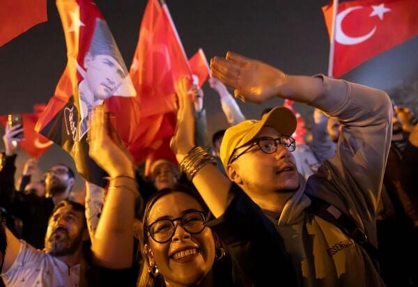 Supporters of Istanbul Mayor Ekrem Imamoglu, mayoral candidate of the main opposition Republican People's Party (CHP), celebrate following the early results in front of the Istanbul Metropolitan Municipality (IBB) in Istanbul.