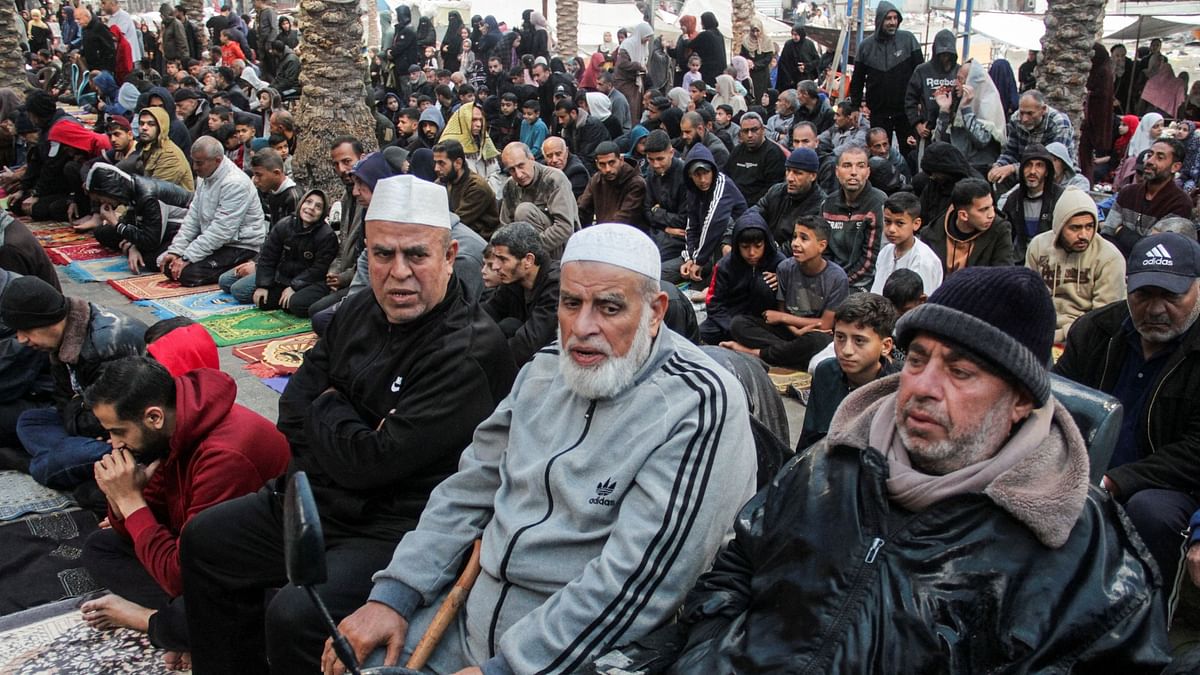 Palestinians attend Eid al-Fitr prayers, amid the ongoing conflict between Israel and the Palestinian Islamist group Hamas, in northern Gaza Strip.