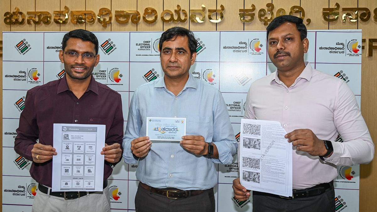 Kurma Rao M, Additional Chief Electoral Officer, Manoj Kumar Meena Chief Electoral Officer Karnataka, R Venkatesh Kumar Additional Chief Electoral Officer show the voter list enabled with QR code, election booth details and brochure during a press conference on Lok Sabha election preparations at Chief Electoral office in Bengaluru.