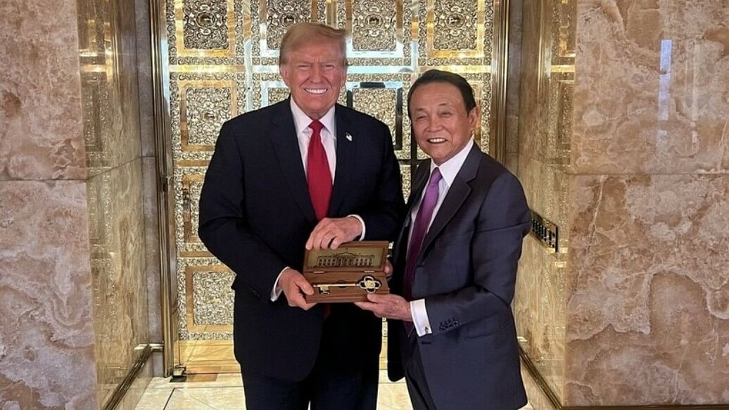 Donald Trump meets with Japan's former prime minister Taro Aso