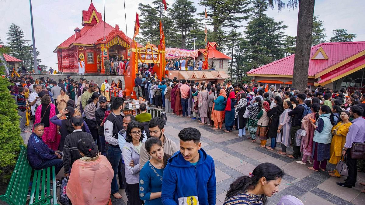 Devotees arrive at Jakhu temple to offer prayers on the occasion of 'Hanuman Jayanti', in Shimla.