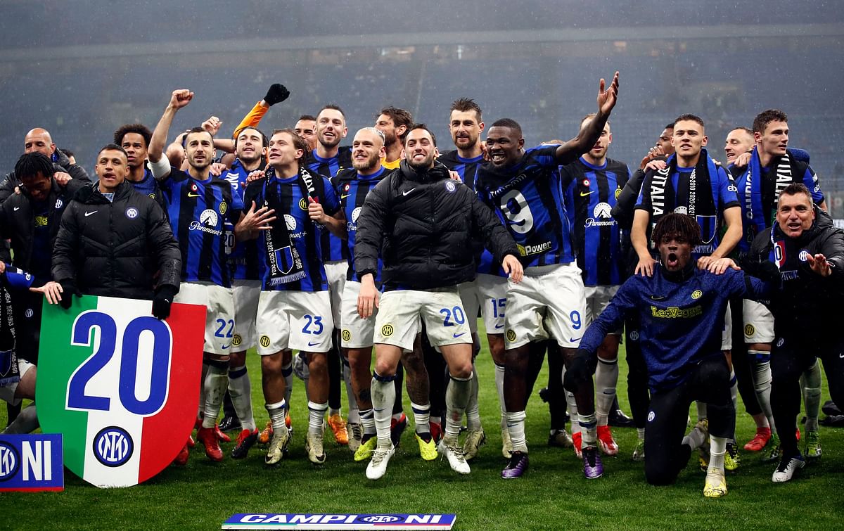 Inter Milan players celebrate their 20th Serie A title after their 2-1 win over arch-rivals AC Milan.