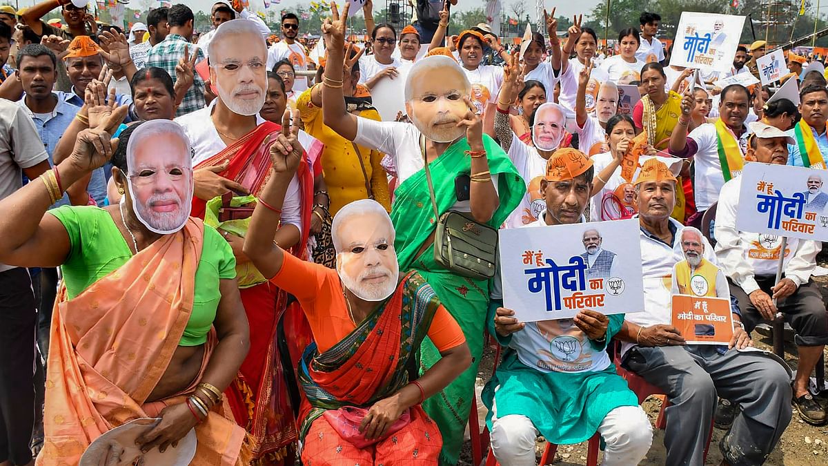 Supporters cheer during a public meeting addressed by Prime Minister Narendra Modi in Nalbari, Assam.