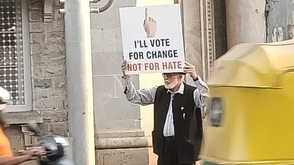 Lok Sabha Polls 2024 | ‘Petrol Uncle’ walks with banner to ‘vote for change, not for hate’