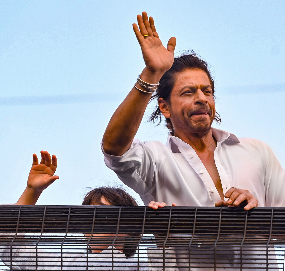 Bollywood actor Shah Rukh Khan waves at fans on the occasion Eid festival, in Mumbai, Thursday. 