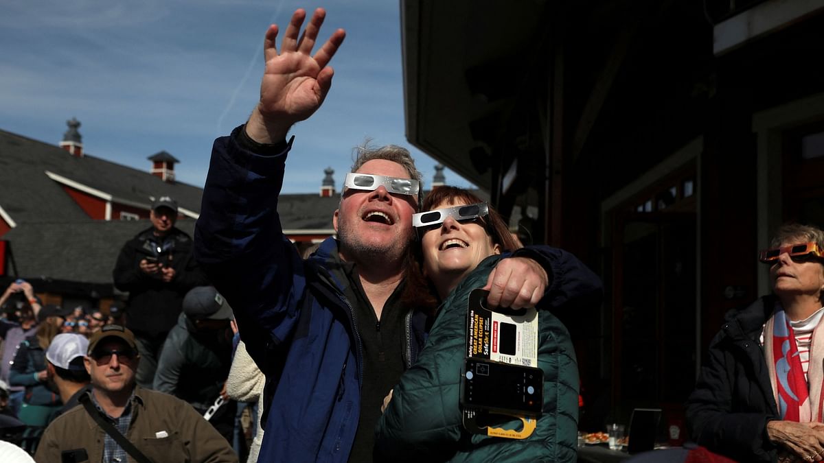 People assemble to view the total solar eclipse at Sugarbush ski resort in Warren, Vermont, US.