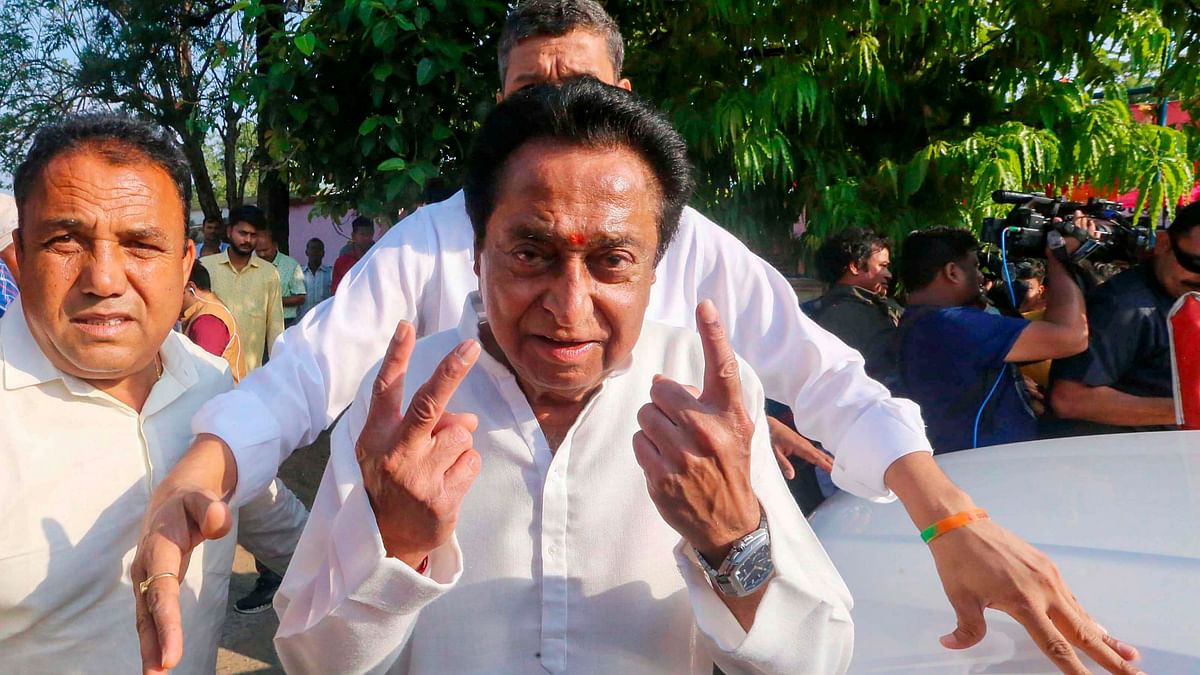 Congress candidate Kamal Nath shows his finger marked with indelible ink after casting his vote for the first phase of Lok Sabha elections, in Chhindwara.