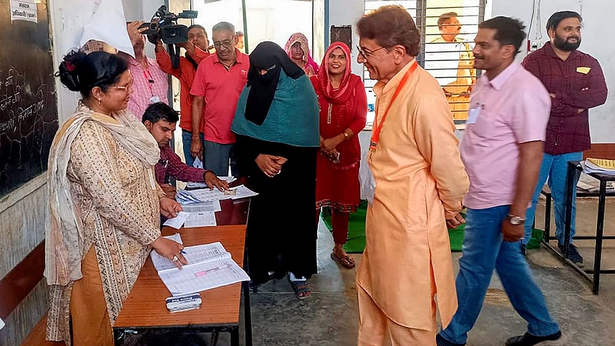 BJP candidate Arun Govil goes through the election procedure before casting his vote for the second phase of Lok Sabha elections, in Meerut.