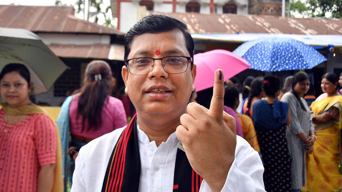Tripura Minister Tinku Roy shows his inked finger after casting his vote in the second phase of Lok Sabha elections, at Dharmanagar in North Tripura.