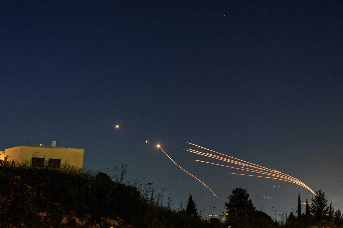 Israel's Iron Dome anti-missile system intercepts rockets launched from Lebanon towards Israel over the Israeli Lebanese border, as seen from northern Israel, April 12, 202