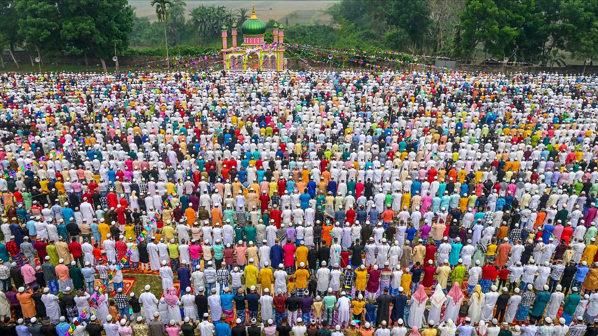 Muslim devotees offer namaz during Eid-ul-Fitr celebrations, at a ground, in Nadia, Bengal.