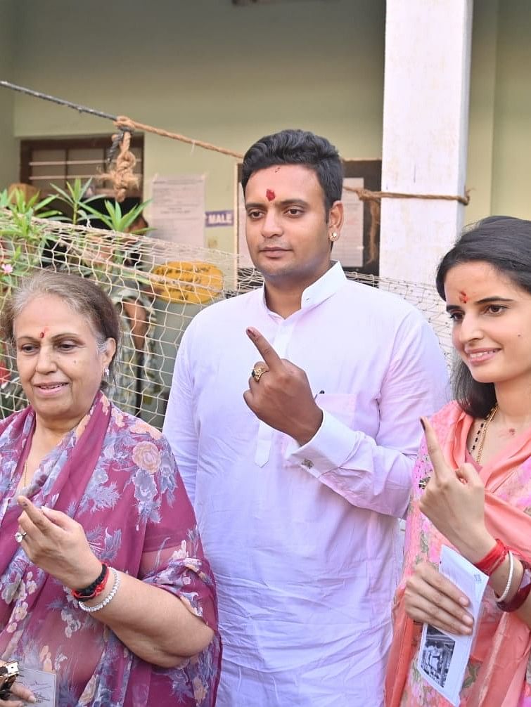 Mysore-Kodagu NDA candidate Yaduveer Krishnadatta Chamaraja Wadiyar, along with his wife Trishika Kumari and mother Pramoda Devi Wadiyar pose for the cameras after casting their votes in Mysuru.