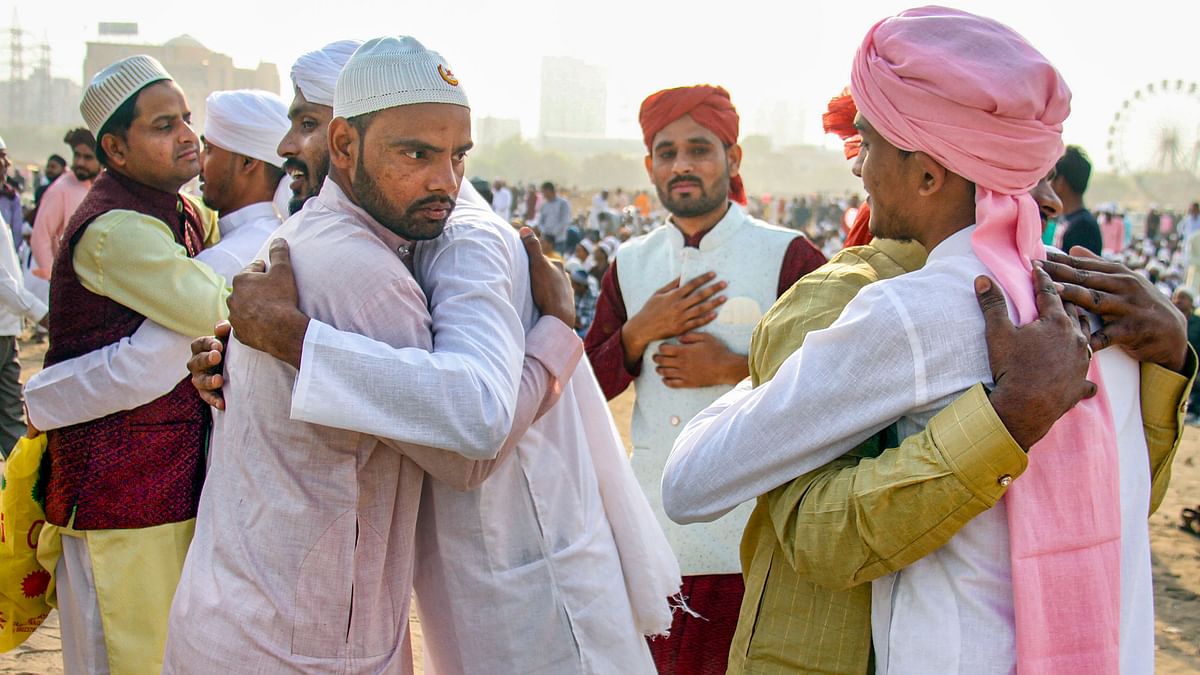 Muslims exchange greetings during Eid-ul-Fitr celebrations, at the Leisure Valley ground, in Gurugram.