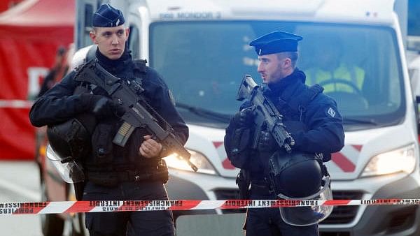France launches manhunt as gunmen ambush van to free inmate, kill two prison guards