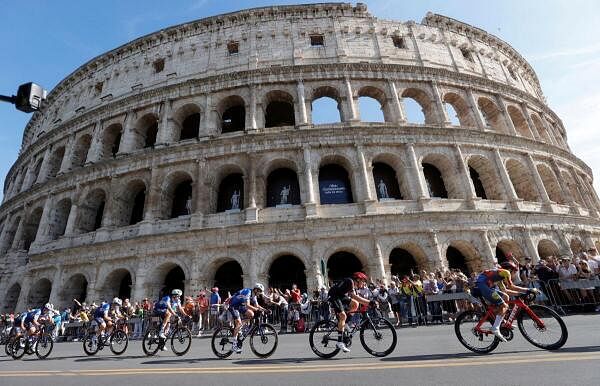 Giro d'Italia - Stage 21 - Roma to Roma - Italy - May 26, 2024 General view as the peloton passes the Colosseum during stage 21
