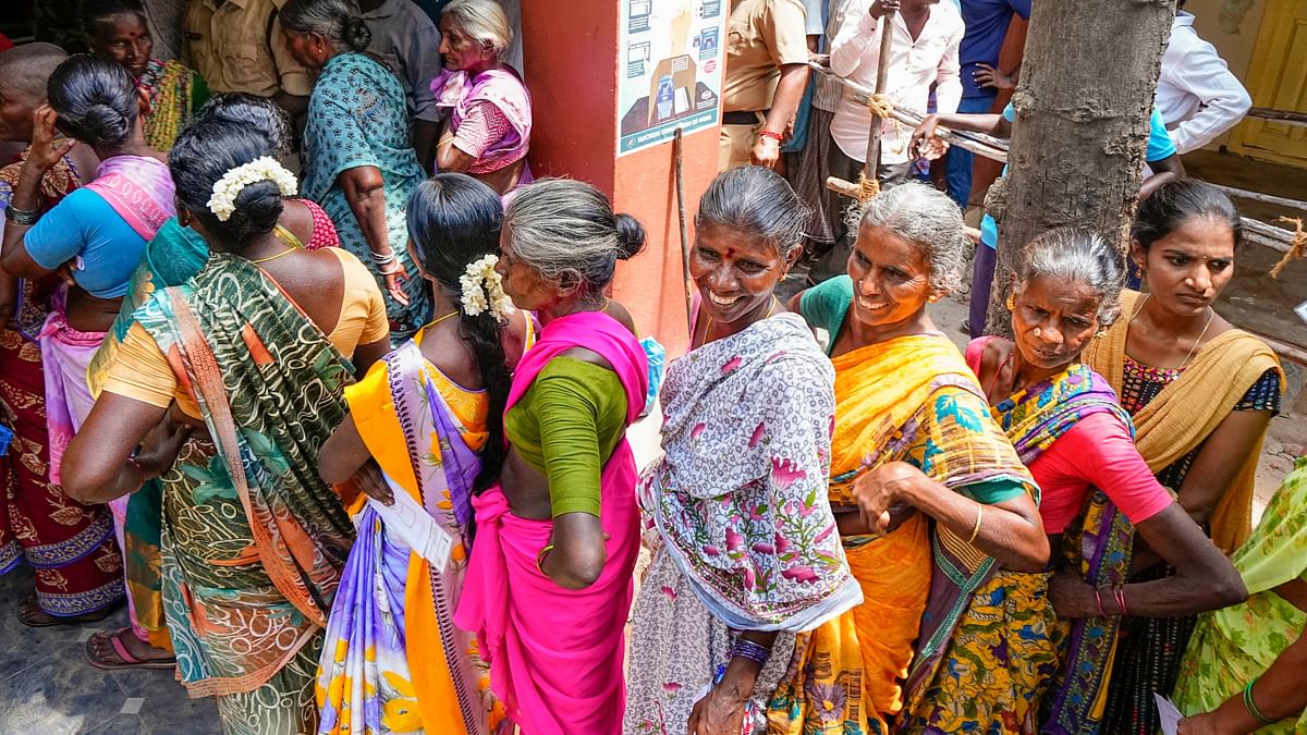 People wait to cast their vote for the fourth phase of Lok Sabha elections and Andhra Pradesh Assembly election, in Tirupati.