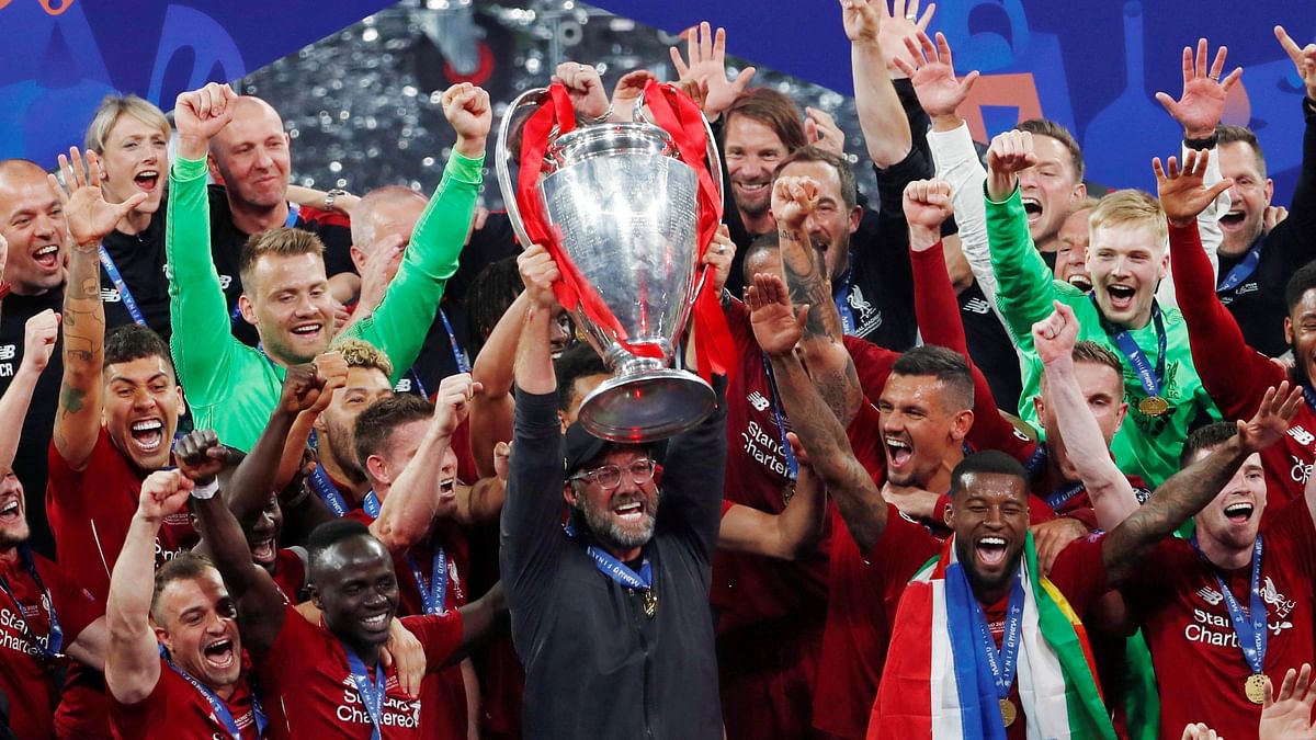 Liverpool manager Juergen Klopp lifts the trophy as they celebrate winning the Champions League