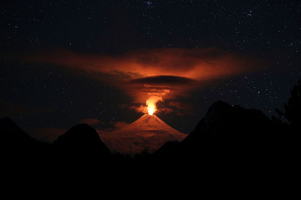 A view shows activity of the Villarrica volcano during the night, as seen from Pucon, Chile