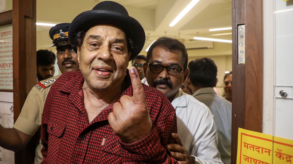 Legendary actor Dharmendra shows his inked finger after casting his vote for the fifth phase of Lok Sabha elections, in Mumbai.