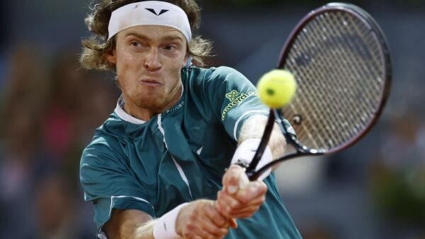 Fiery Andrey Rublev keeps a cool head to move on in Madrid