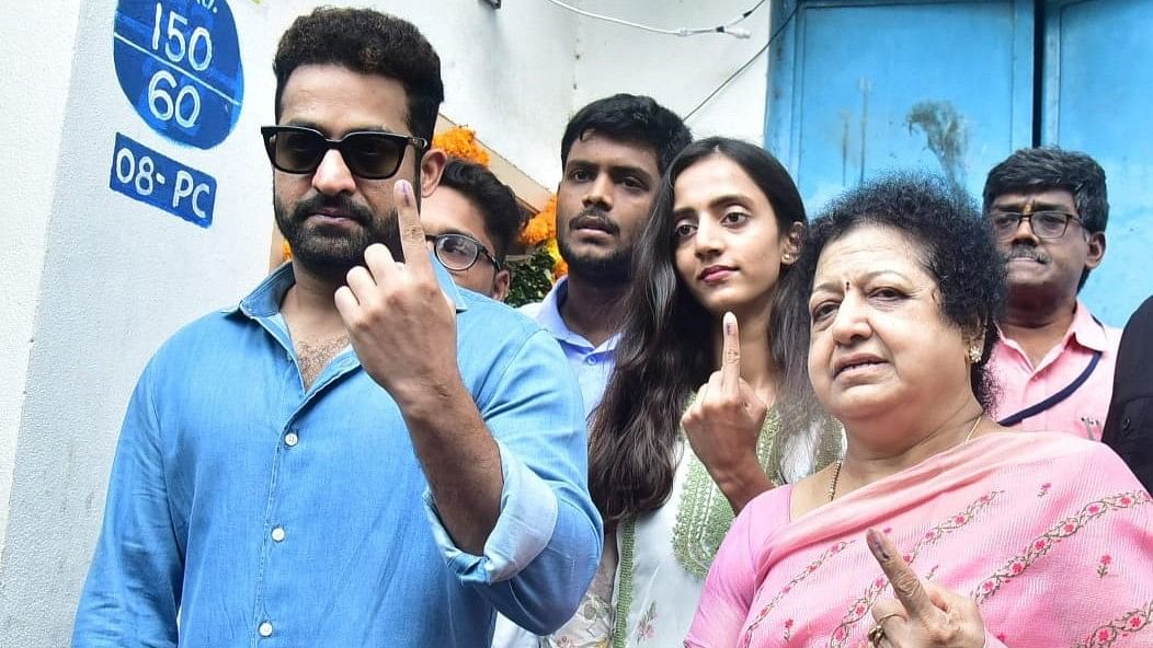Devara star Jr NTR, and his family show ink marked fingers after voting at a polling booth in Jubilee Hills, Hyderabad.