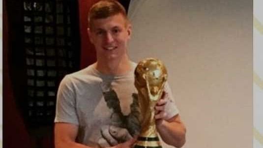 Toni Kroos with the 2014 World Cup trophy.