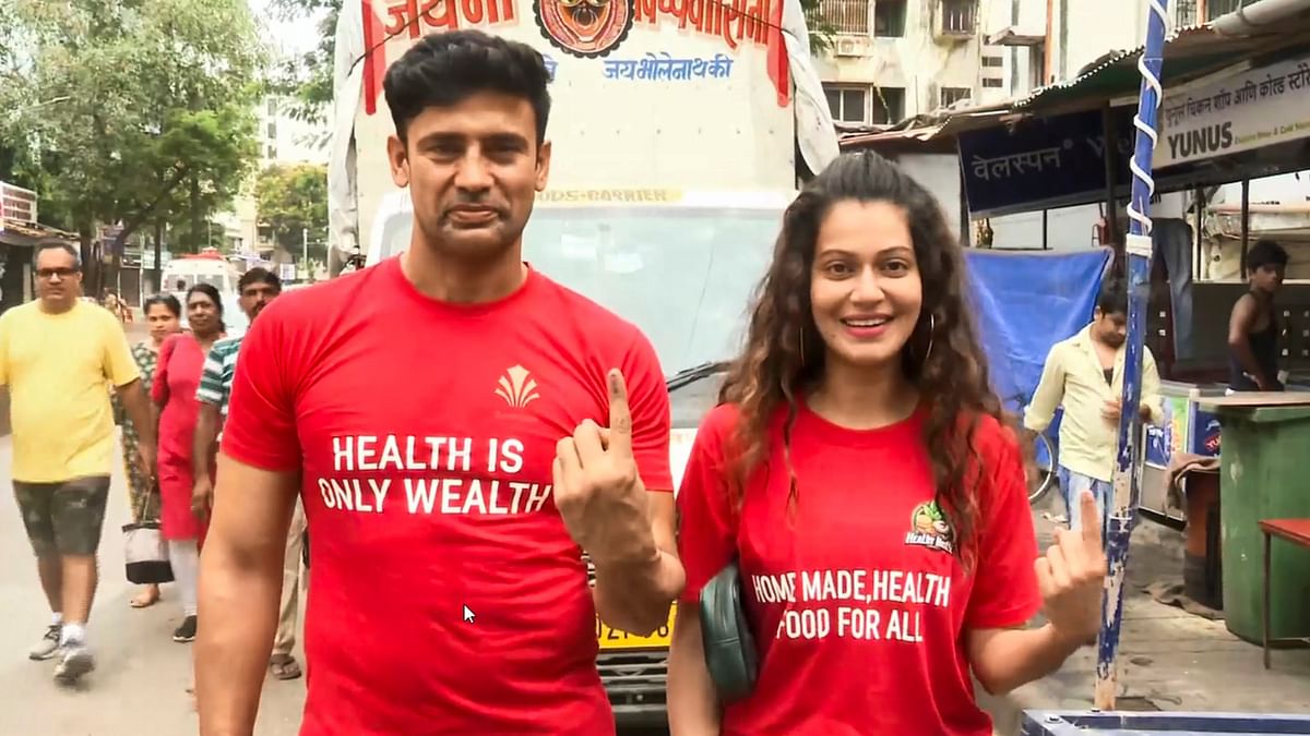 Celebrity couple Sangram Singh and Payal Rohatgi show their ink-marked fingers after casting their votes in the fifth phase of Lok Sabha elections, in Mumbai.