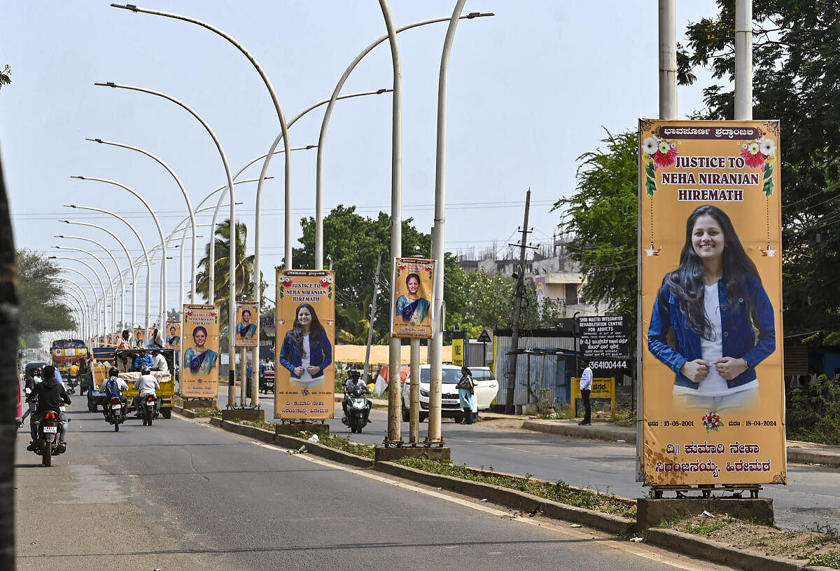 Banners of Neha Hiremath, a student who was stabbed to death on the campus of her college, put up on a road leading to her residence, in Hubballi.