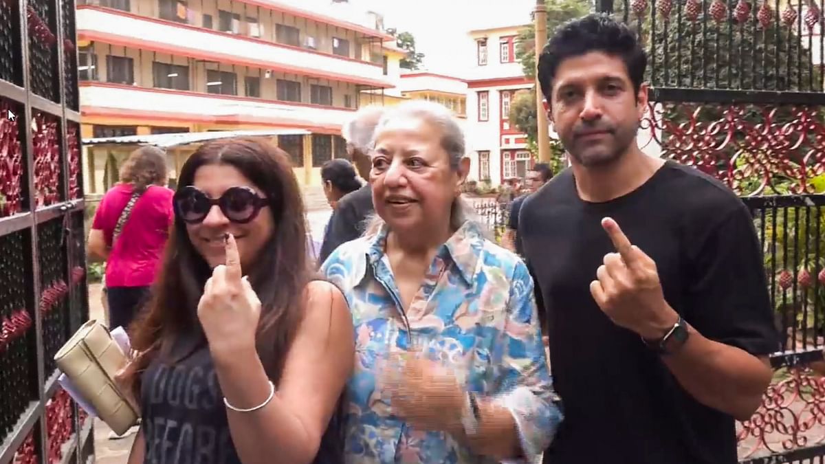 Bollywood actor Farhan Akhtar and film director Zoya Akhtar and their mom Honey Irani show their inked fingers after casting their votes during the fifth phase of Lok Sabha elections, in Mumbai.