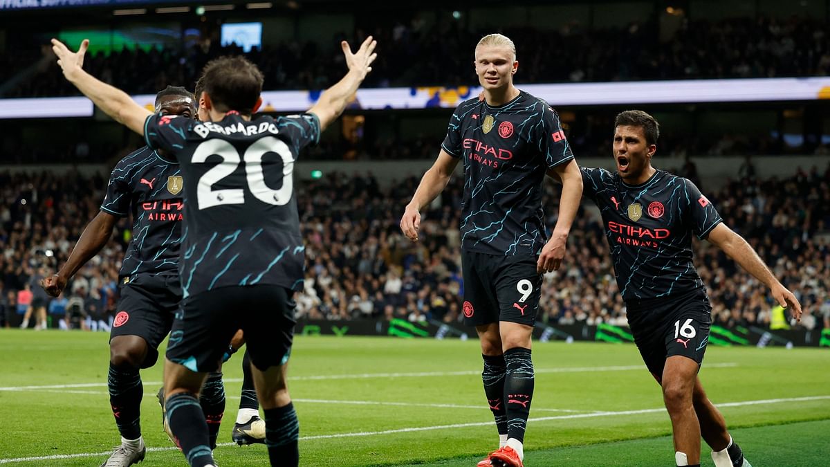 Erling Haaland double puts Manchester City on brink of Premier League title