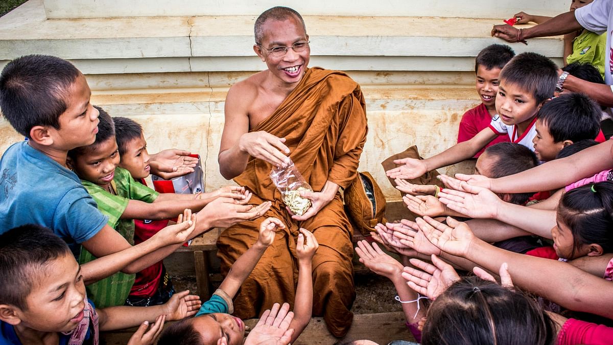 Charity: Acts of charity, such as donating food, clothes, and money to the needy, are highly encouraged. Offering food to monks and priests is also a common practice.